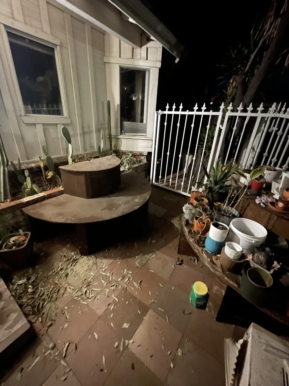 Wood planks and boards, some with nails still in them, stuffed into white bags left on the curb at night.